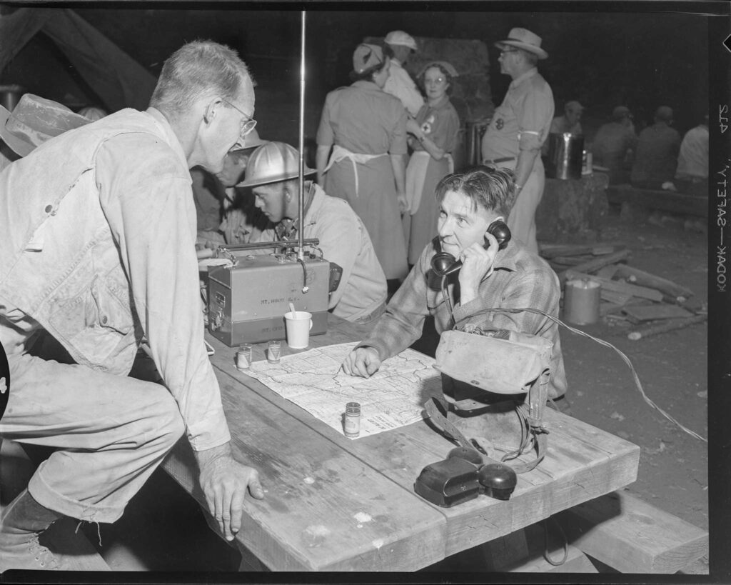 Radio dispatcher communicating during the forest fires